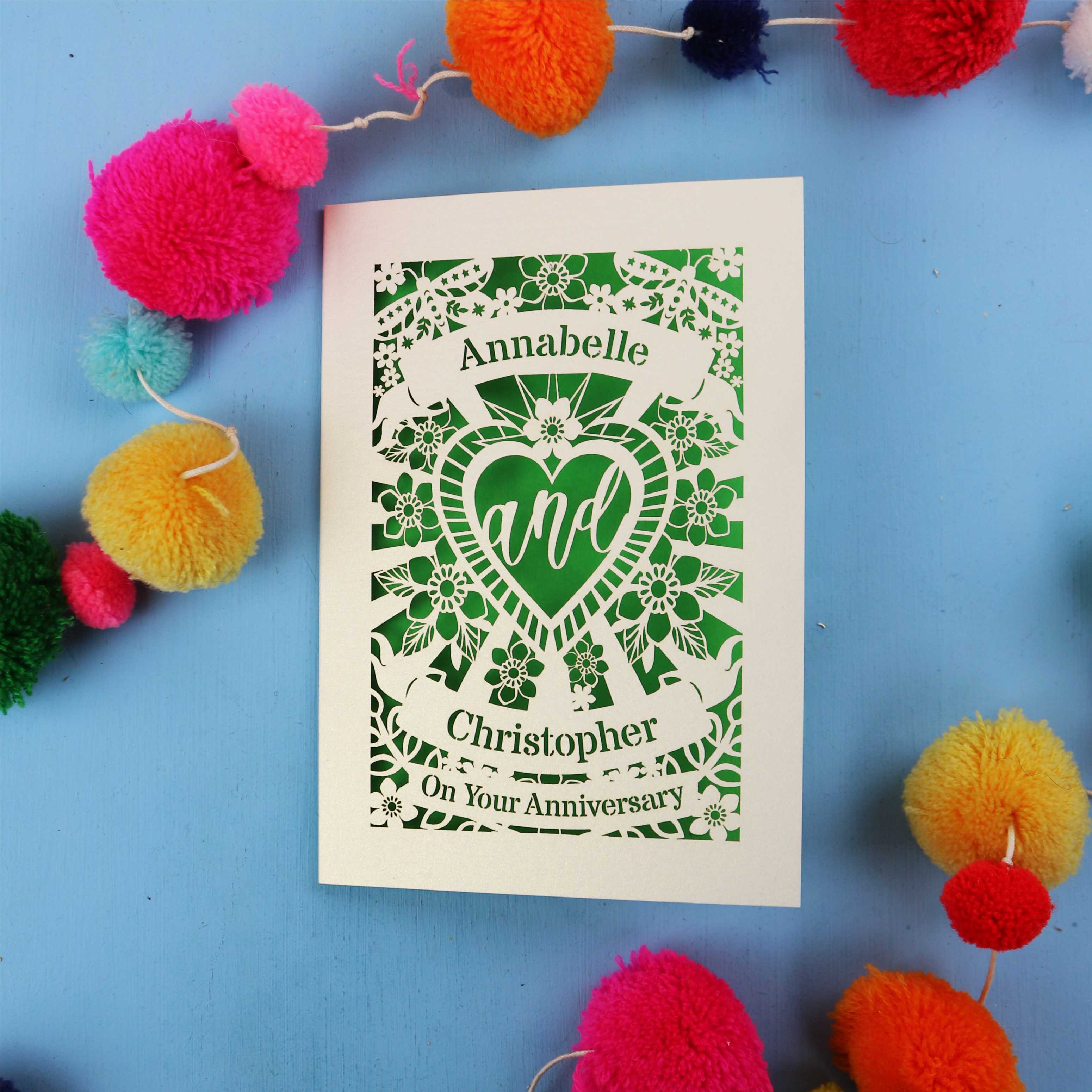 Personalised laser cut anniversary card with decorative elements on a blue background