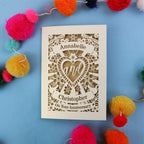 Personalised wedding anniversary card with decorative elements on a blue background