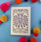 Personalised laser cut anniversary card with decorative elements on a blue background