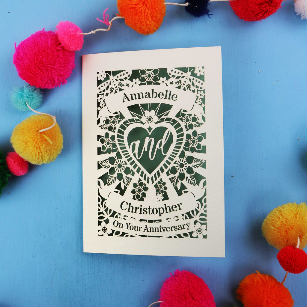 Personalised laser cut wedding anniversary card with decorative elements on a blue background