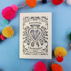 Personalised laser cut anniversary card with decorative elements on a blue background