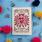 Personalized wedding card with decorative elements on a blue background