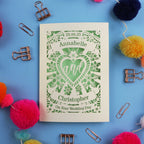 Personalized wedding card with decorative elements on a blue background