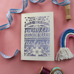 A cut out greetings card for her, that reads "Well behaved women seldom make history"