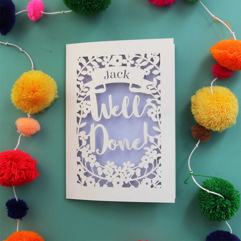 A paper cut card to send congratulations, made in the UK. Laser cut card is personalised with a name and says Well Done in a script font. - A5 / Lilac