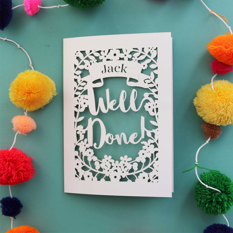 A personalised laser cut achievement card that says "Well Done" and has the recipient's name in a banner - A5 / Sage