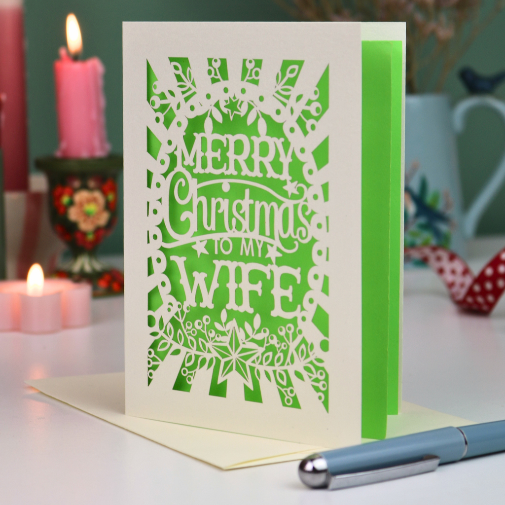 A laser cut wife Christmas card in cream with decorative cut out text, 'Merry Christmas to my Wife'