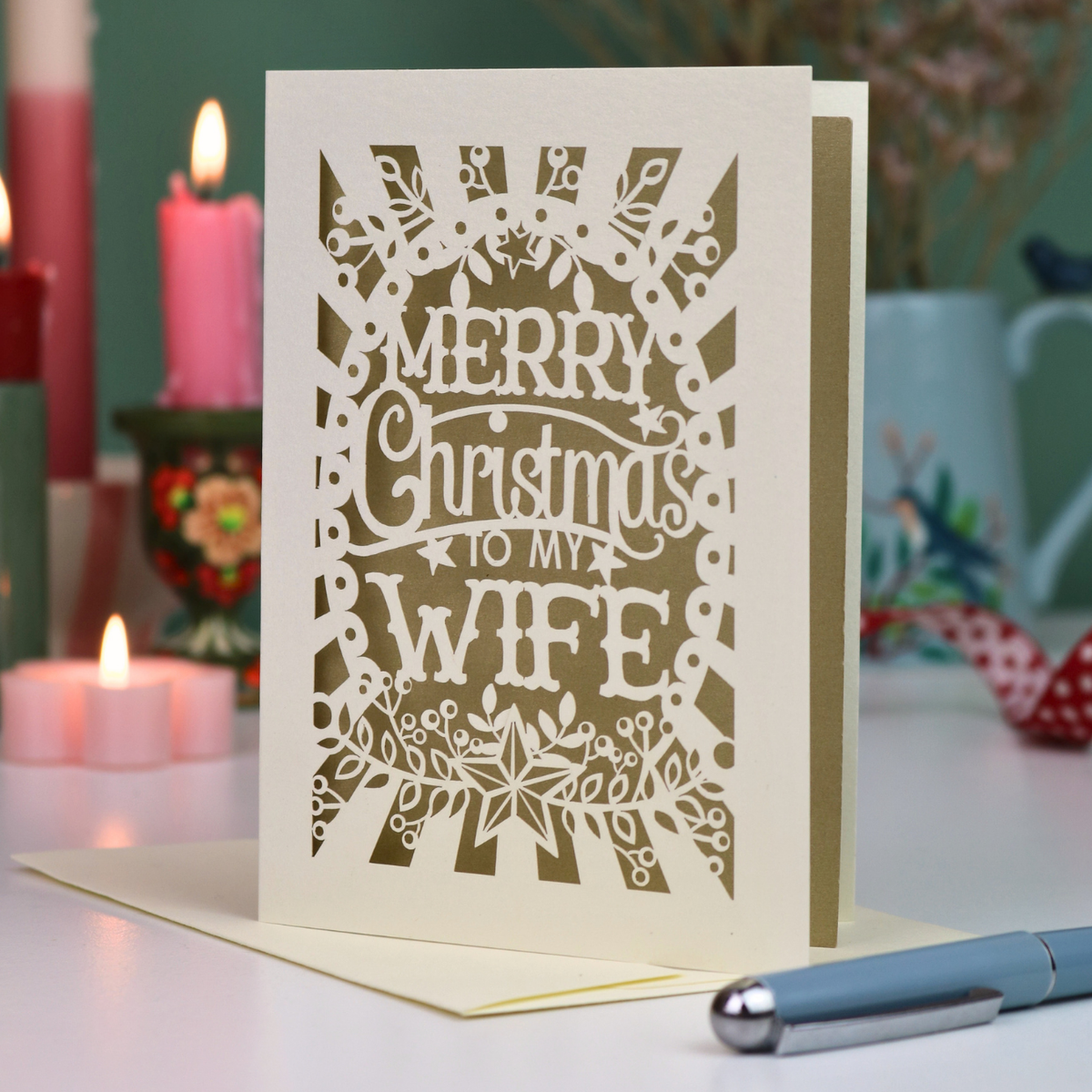 A laser cut wife Christmas card in cream with decorative cut out text, 'Merry Christmas to my Wife'