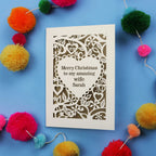 Wife Christmas card with personalized message on a blue background with colourful pom-poms.