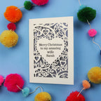 Wife Christmas card with personalized message on a blue background with colourful pom-poms.