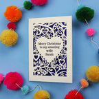 Wife Christmas card with personalized message on a blue background with colourful pom-poms.