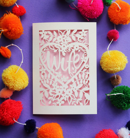 A papercut card that has the word "Wife" inside a heart surrounded by flowers - A5 (large) / Candy Pink