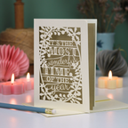 A laser cut Christmas card in cream with decorative text, 'It's the most wonderful time of the year'
