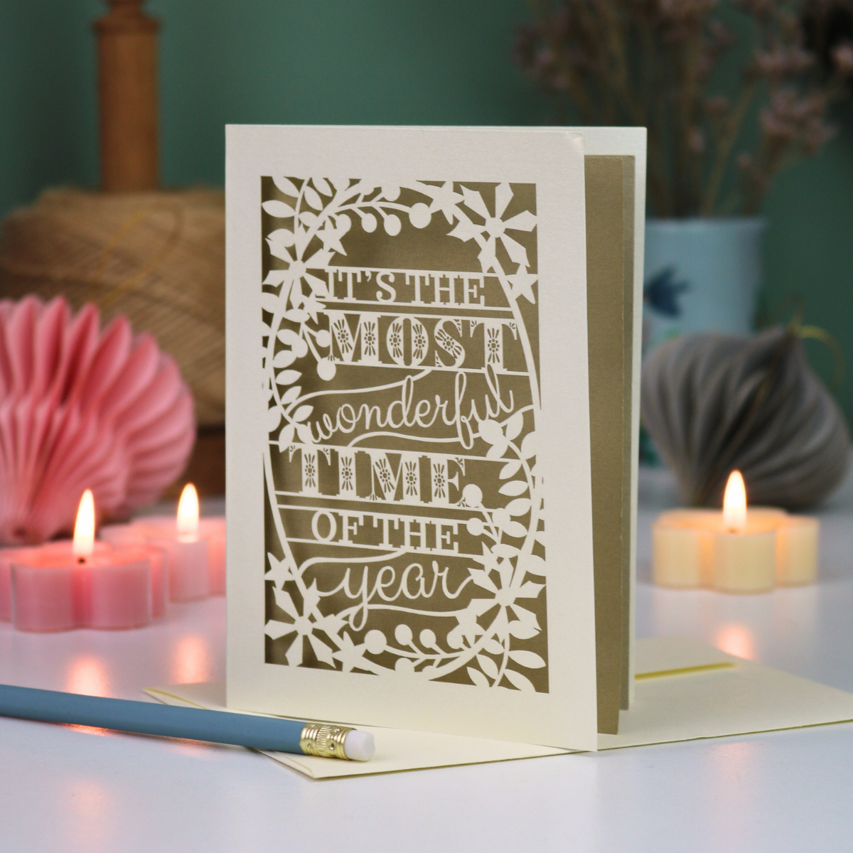 A laser cut Christmas card in cream with decorative text, 'It's the most wonderful time of the year'