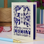 A laser cut 1st birthday card with decorative 1 and woodland design including owl, bunnies, squirrel and hedgehog, personalised with a name.