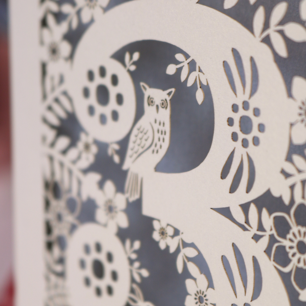 Decorative 3rd Birthday card with floral woodland and owl design, featuring the name 'Florence', on a table with a pen and flowers.