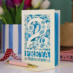 A laser cut 2nd birthday card with woodland design and decorative '2', personalised with a name. The card has tiny cut out woodland elements including bunnies, toadstools, squirrel and owl.