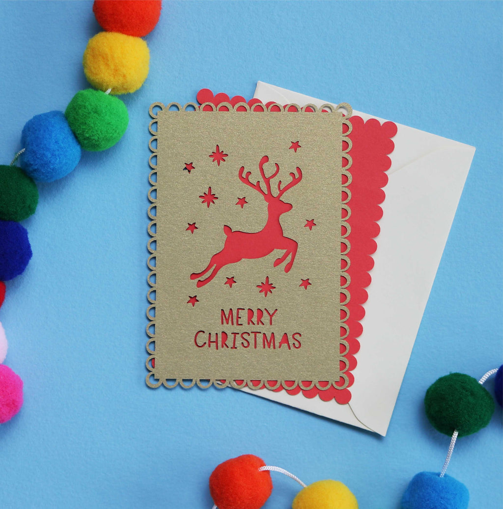 A laser cut Christmas postcard