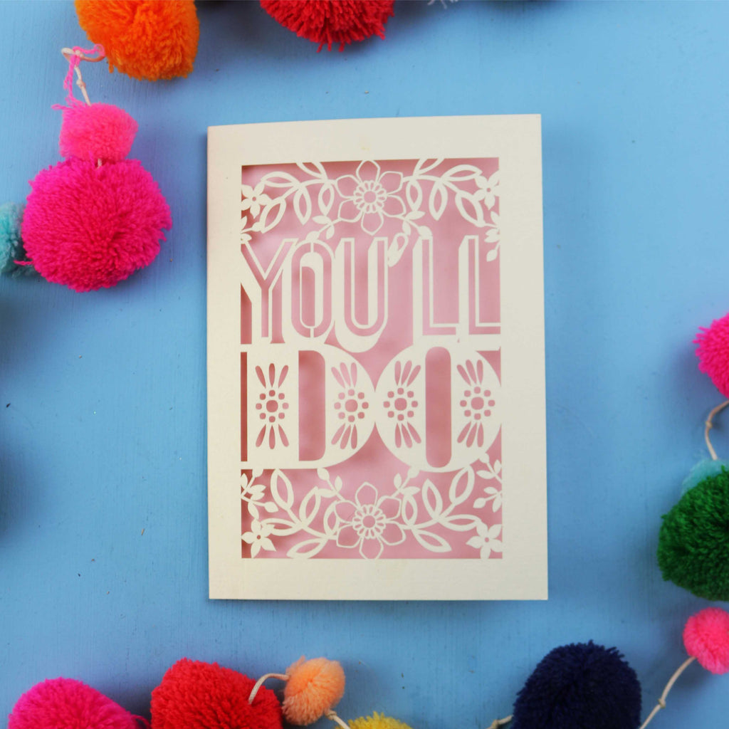 Funny Valentine's card with 'YOU'LL DO' text on a blue background with colourful pom-poms.