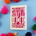 Cheeky Valentine's card with 'YOU'LL DO' text on a blue background with colourful pom-poms.