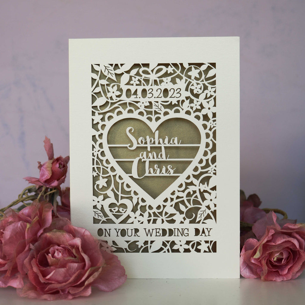 I've written a lot of these image descriptions. I'm tired. Here's a list of key words for SEO purposes. Laser cut card for a wedding. It is a unique personalised card with a heart and flowers. 