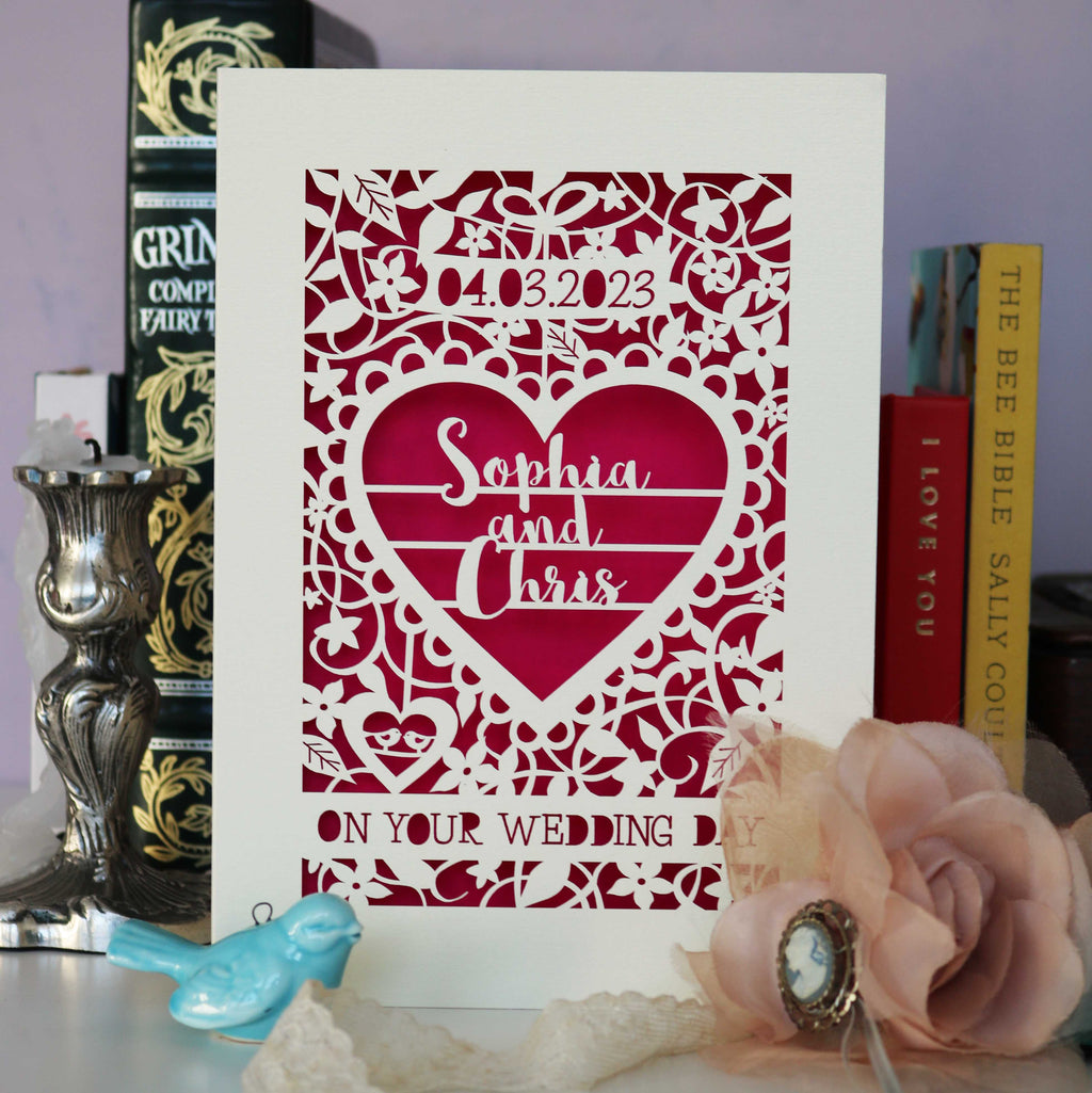 A wedding card laser cut and featuring personalisation with the date of wedding and the names of couple. No photo does the card justice so trust us when we say you need this card because it's beautiful.