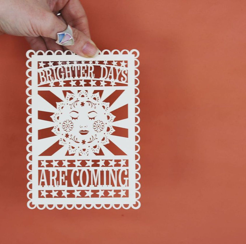 Brighter Days Are Coming, a papercut postcard featuring a sunshine and positive motivational words
