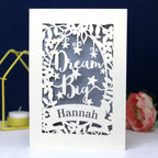 A personalised laser cut card with the words 'Dream Big' and a name 'Hannah' written on it
