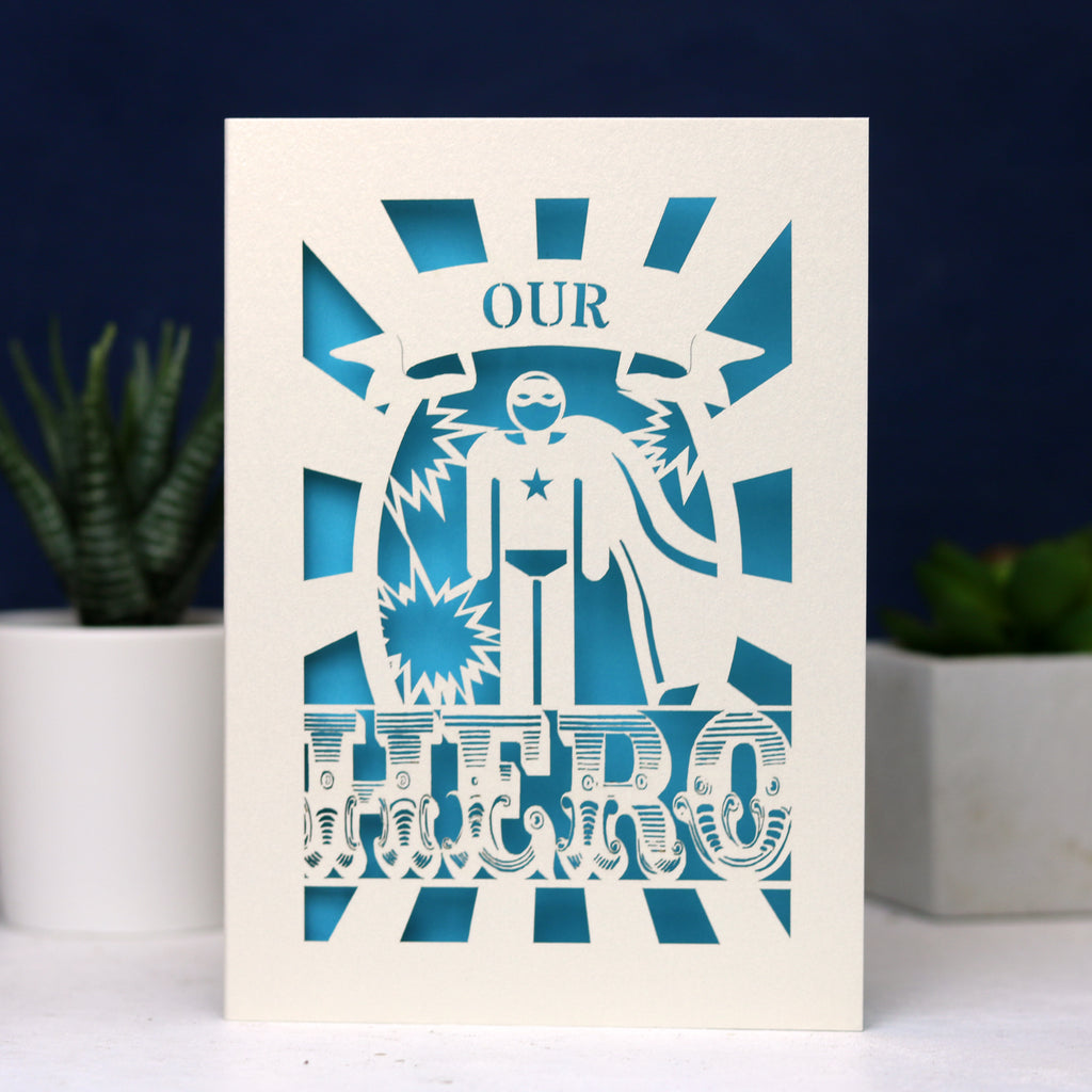 A laser cut UK Father's Day card featuring the words "Our Hero"