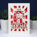 A paper cut Father's Day card that says "Our Hero"
