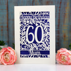 A 60th birthday card for Mum, laser cut from cream card with a deep violet paper insert behind the laser cut.