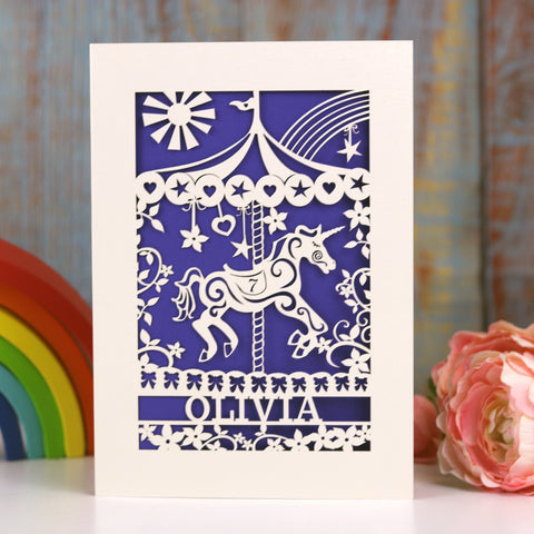 A birthday card for her, personalised card has a name and age as well as a carousel unicorn. - A5 (large) / Infra Violet
