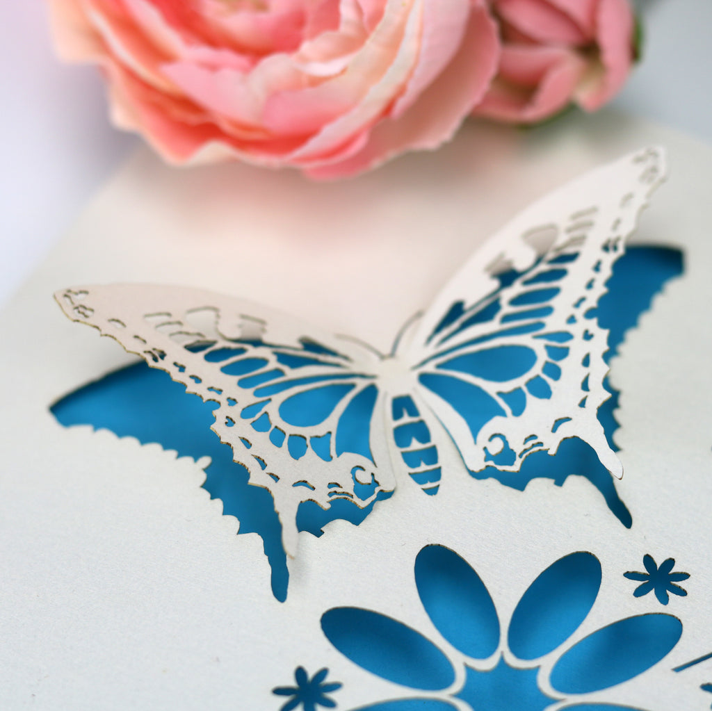 A close up detail of the laser cut butterfly card