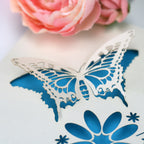 A close up detail of the laser cut butterfly card
