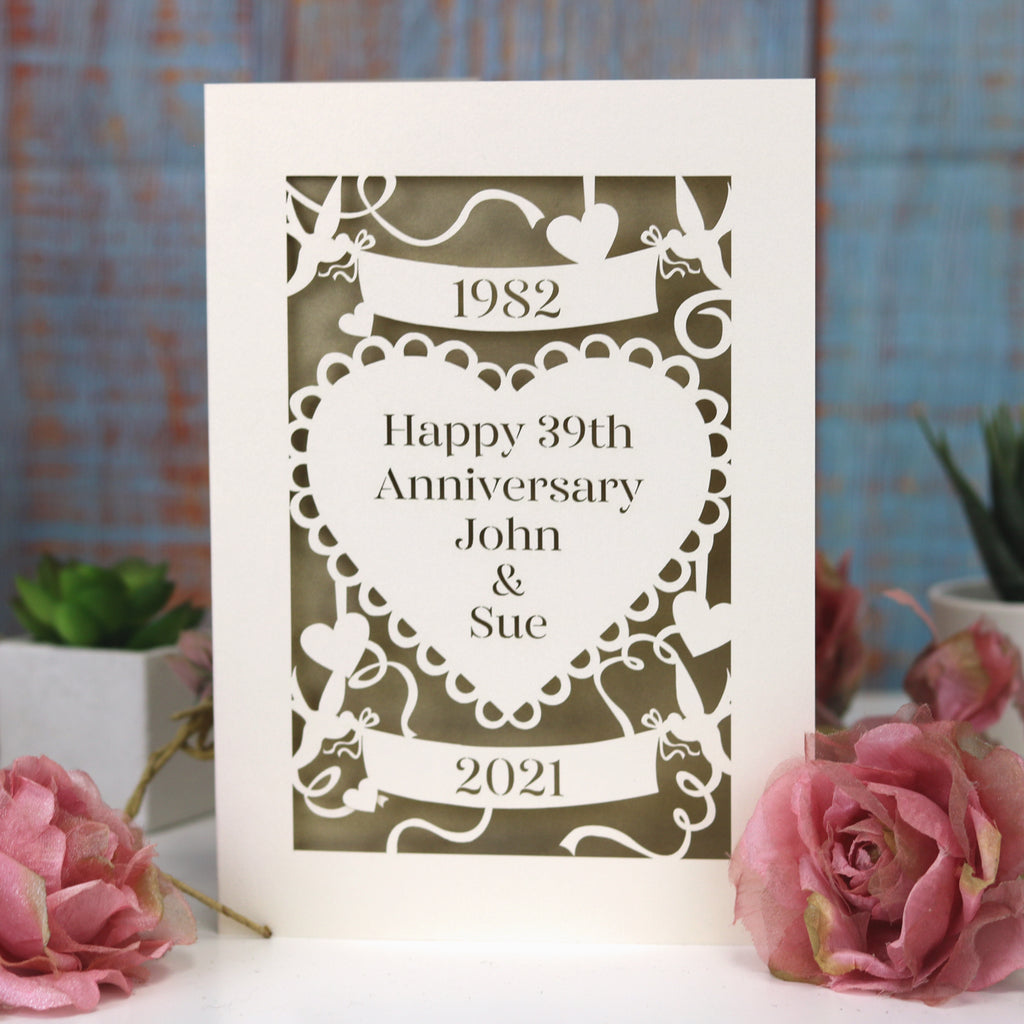 A golden wedding anniversary card laser cut from cream card and with a gold paper insert. 