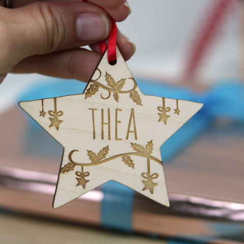 A small engraved wooden star Christmas tree decoration - 