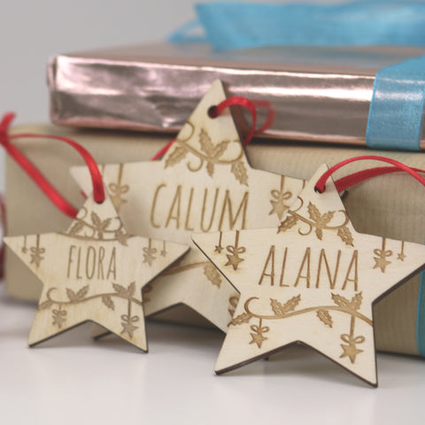 Three different sized Christmas decorations personalised with engraved names - 