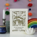 A laser cut card for Baptisms. Personalised with a name and date, with a church surrounded by flowers 