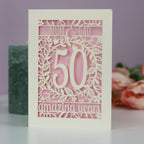 A 50th anniversary card for Mum & Dad. Card is laser cut and reads Mum & Dad, 50 amazing years.