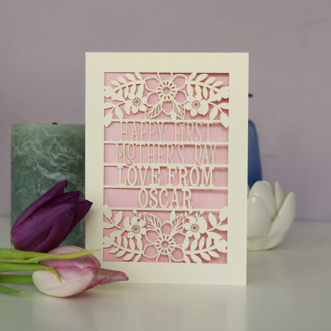 A paper cut First Mother's Day card with cut out text that says "Happy First Mother's Day, love from" and is personalised with a name - A5 / Candy Pink