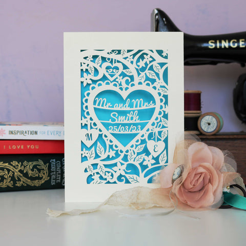 A paper cut wedding card personalised and hand finished with a blue paper insert.  - A5 / Peacock Blue