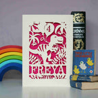 A cream and pink dinosaur card for girl's birthday.