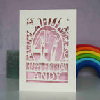 Personalised laser cut birthday cards for friends and family. Personalised with an age and a name. Card is cream with a candy pink paper behind laser cut card