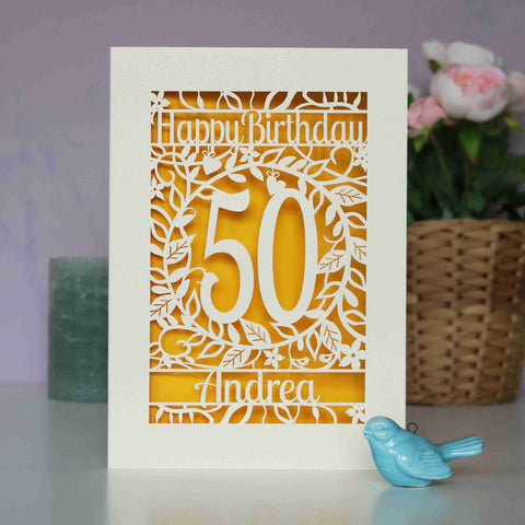 A floral birthday card with an age and a name laser cut from cream card. There is a warm sunshine yellow paper behind the laser cut card. - A5 / Sunshine Yellow