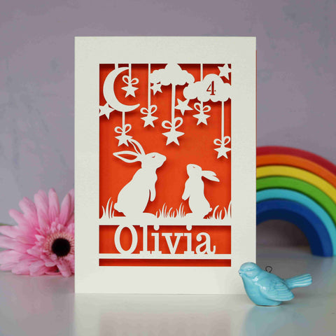 A laser cut personalised birthday card with two rabbits looking at the sky - A5 / Orange