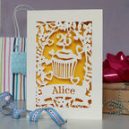 Personalised papercut cupcake birthday card. Shows a cupcake with an age topper laser cut from cream card with a sunshine yellow background. Great for mum, sister, girlfriend, any one who likes cake!
