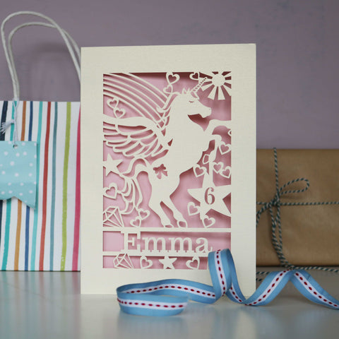 Image shows a laser cut unicorn birthday card with cut out card to reveal a candy pink background - A5 / Candy Pink