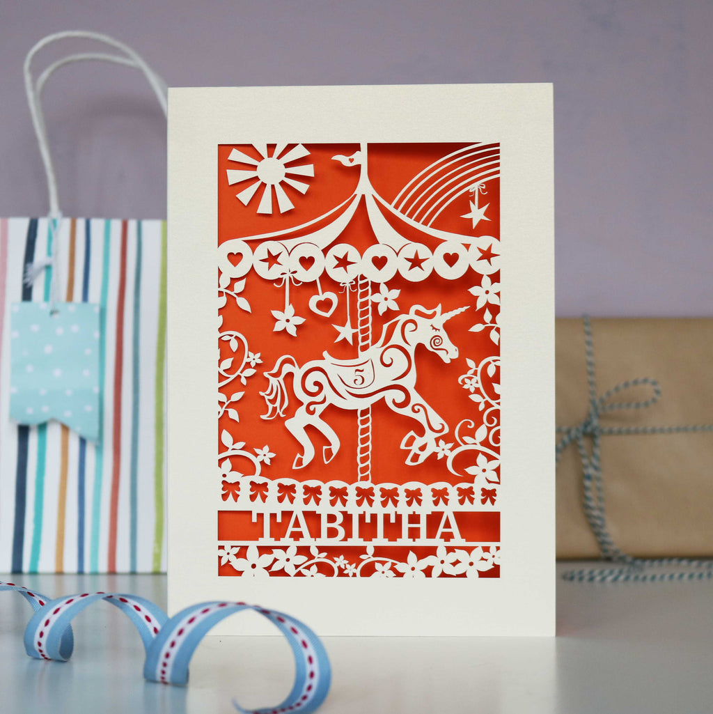 Children's birthday card with a paper cut carousel horse. 