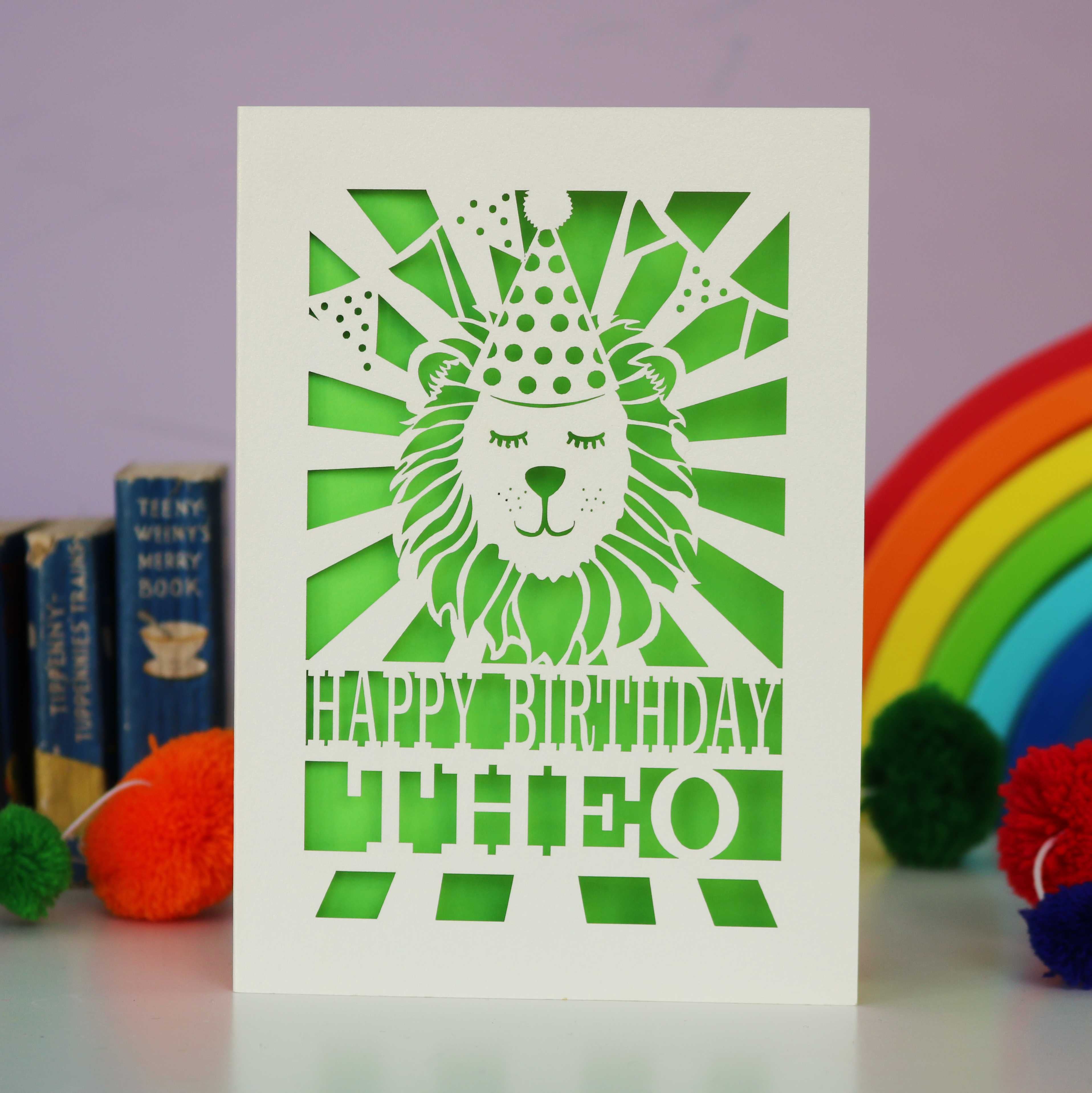 A cream and green laser cut birthday card with lion