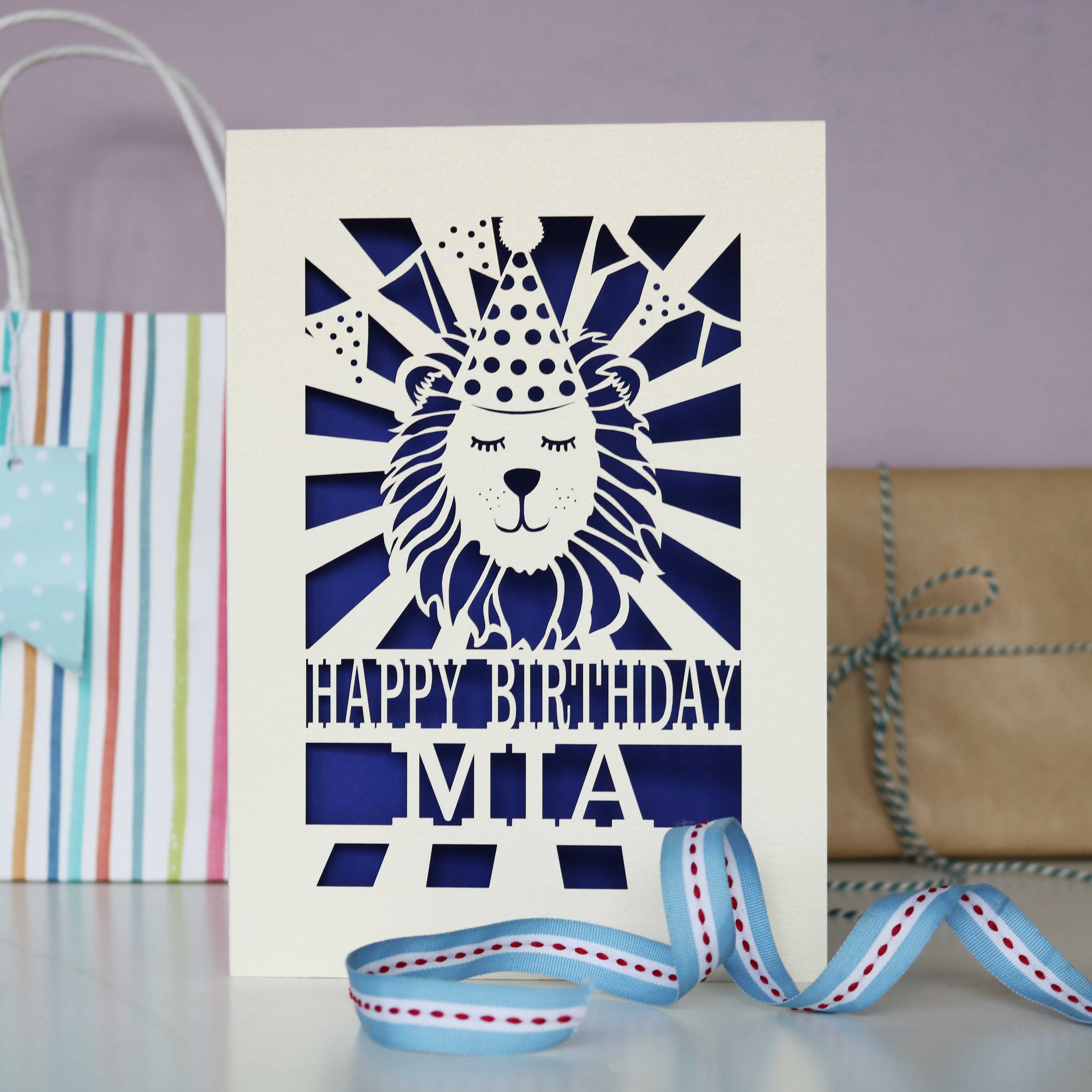 A cream and violet laser cut lion birthday card for kids